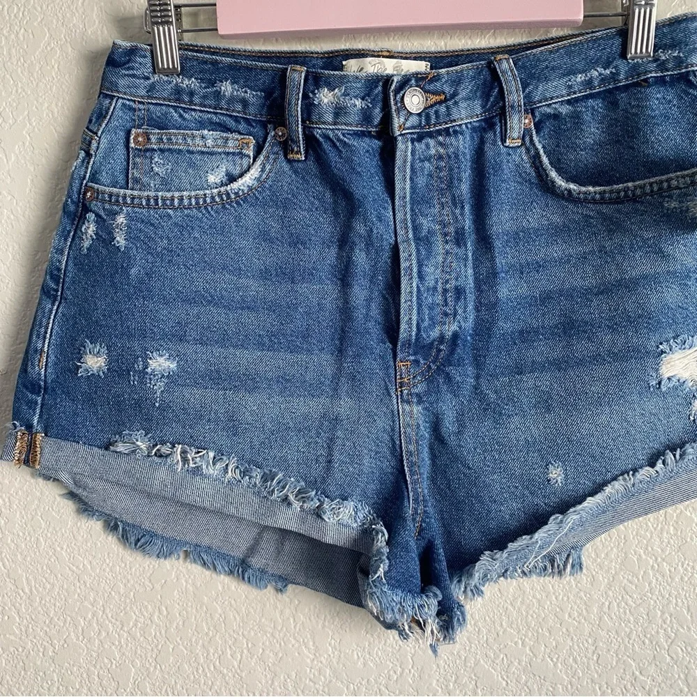 Free People Medium Wash Distressed Raw Hem Denim Shorts